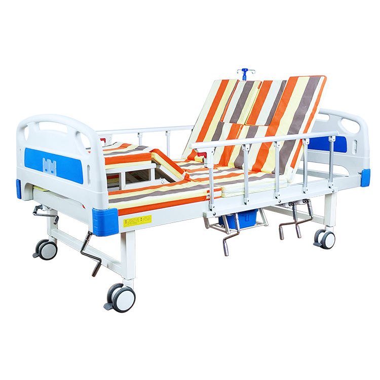 Venta en caliente Manual de cama de la cama de la cama del hospital multifuncional girando las camas de enfermería del hospital con inodoro automático