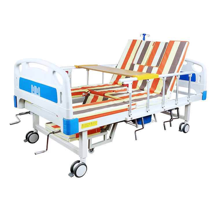 Venta en caliente Manual de cama de la cama de la cama del hospital multifuncional girando las camas de enfermería del hospital con inodoro automático